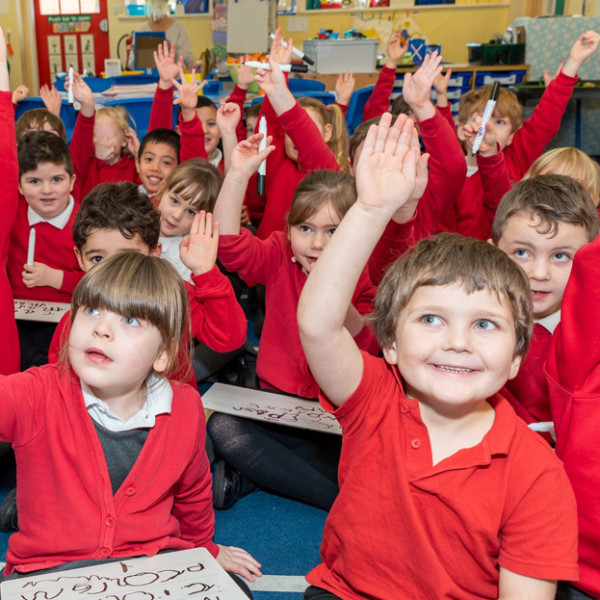 Cononley Students with their hands up