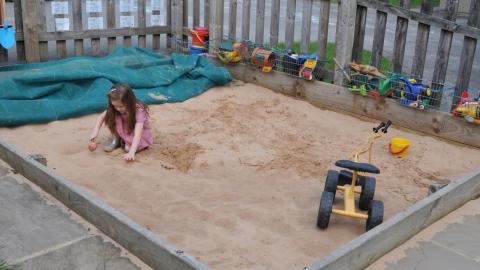 Child in sand pit