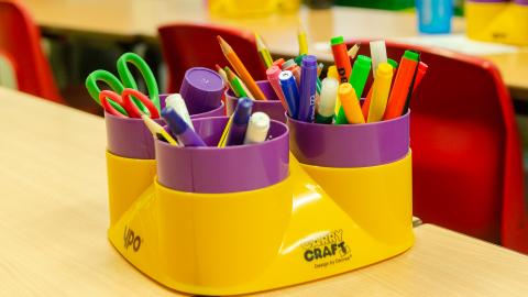 Picture of a stationery pop chain coloured felt tip pens, scissors and glue
